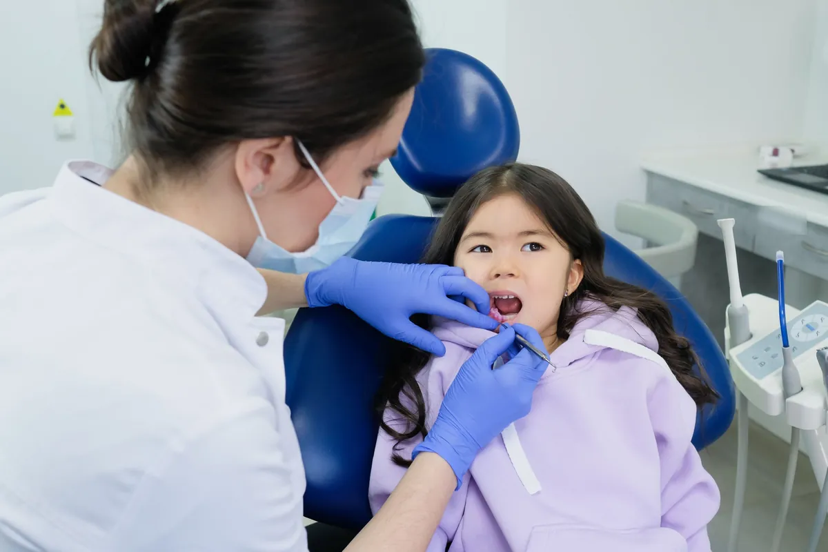 Young girl relaxed in the dental chair during her checkup